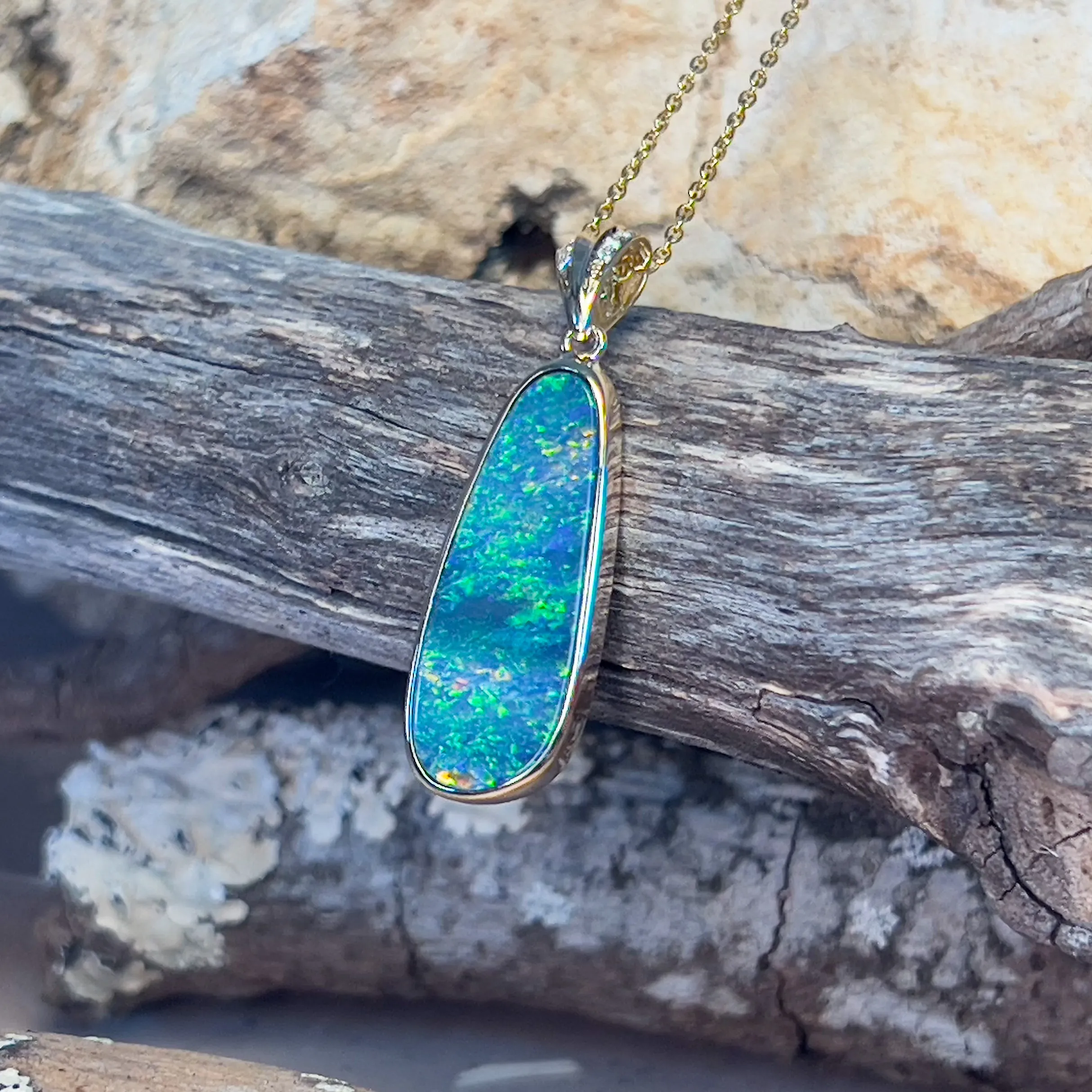 14kt Yellow Gold Long Opal 6.65ct doublet with diamonds pendant