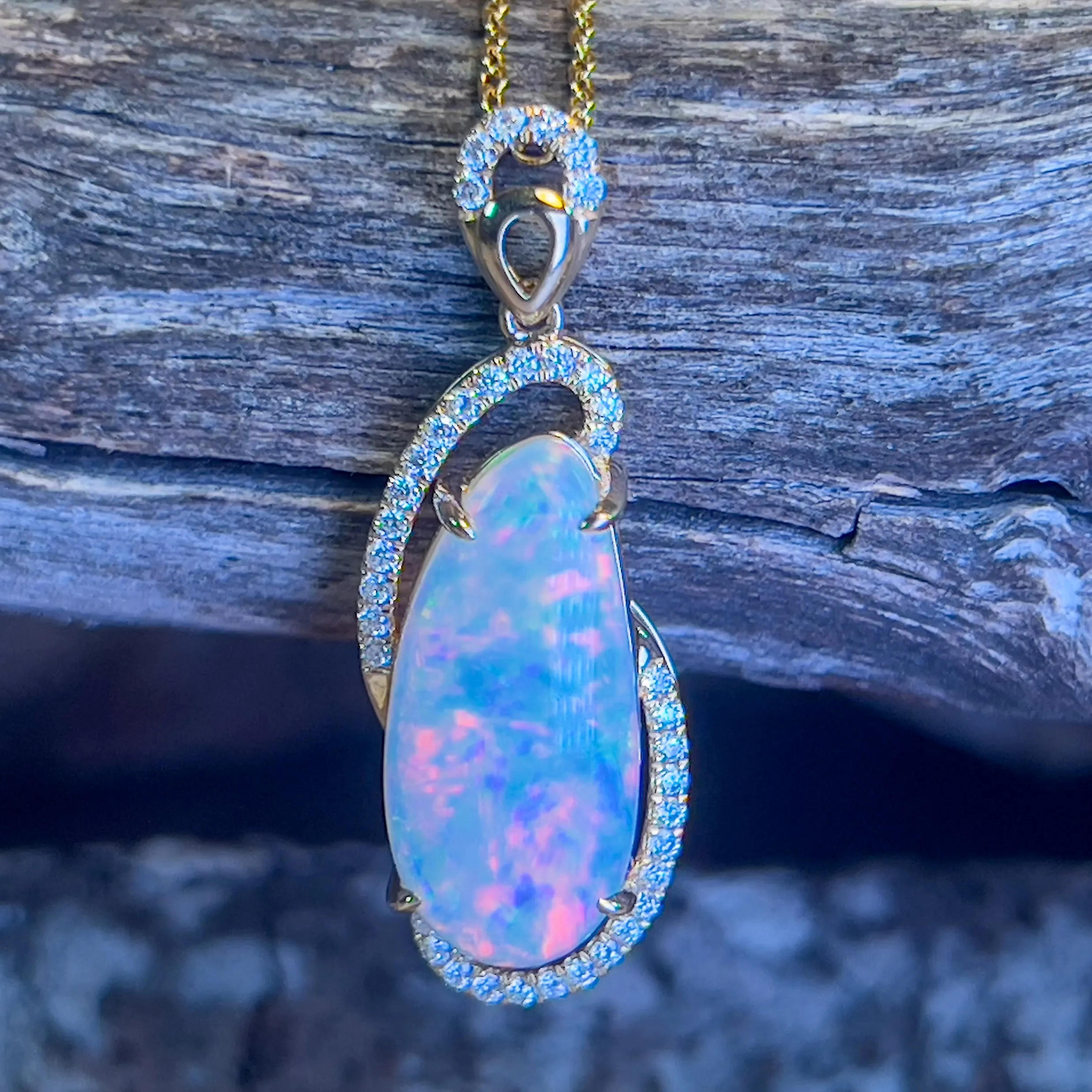 18kt Yellow Gold 4.72ct Freeform Crystal Opal and diamond pendant